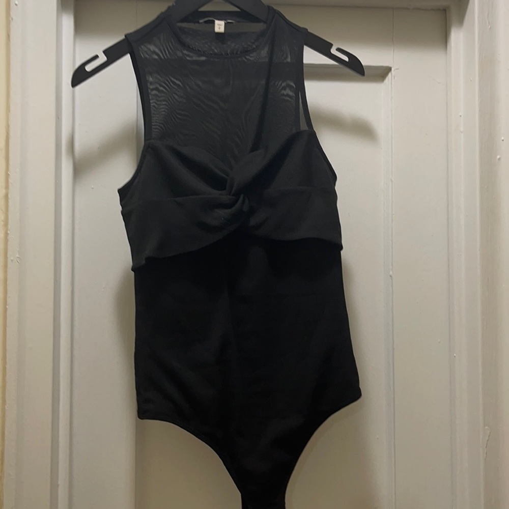 A beautiful body contour top. A most have in your closet.
